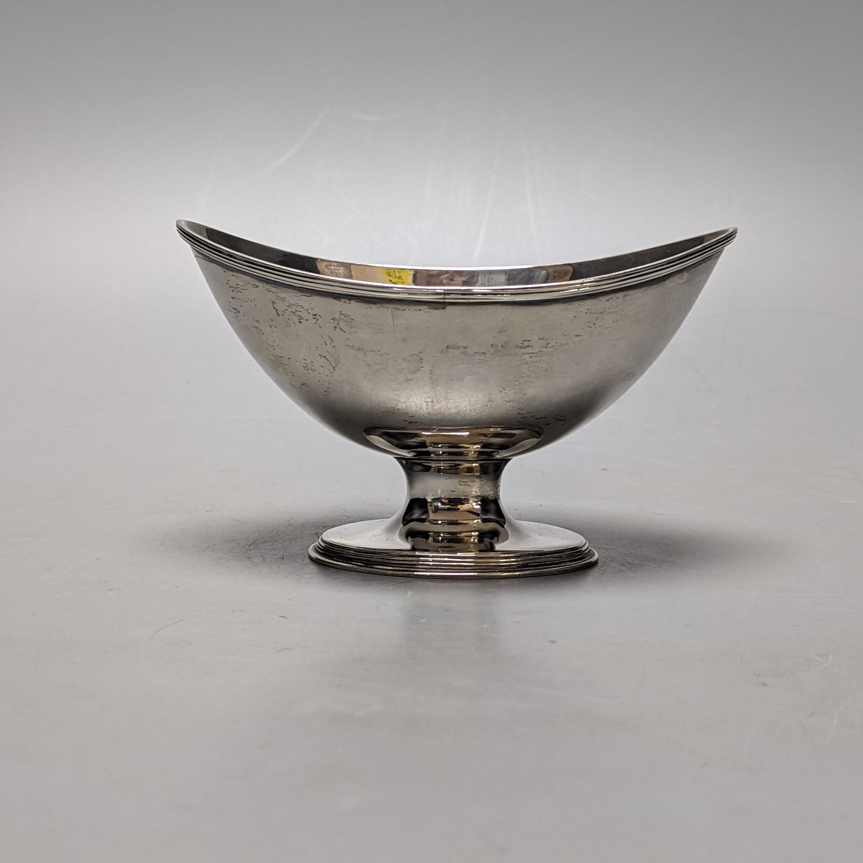 A George III silver sugar bowl, (ex basket), maker's mark double stamped, London, 1790, length 13.6cm